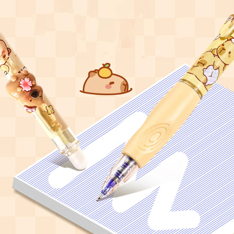 Two capybara-themed pens on a notebook with a light background displaying that they are eraseable