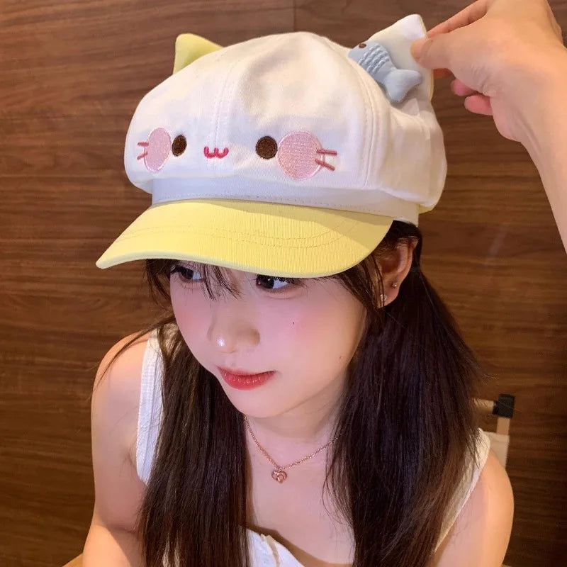 Person wearing a cute cat-themed baseball cap with a wooden background