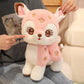 Kawaii pink deer plushie on a person's lap