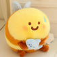 kawaii bee plushie sitting on a cream color desk