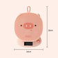 Pink pig-shaped scale with dimensions on a white background