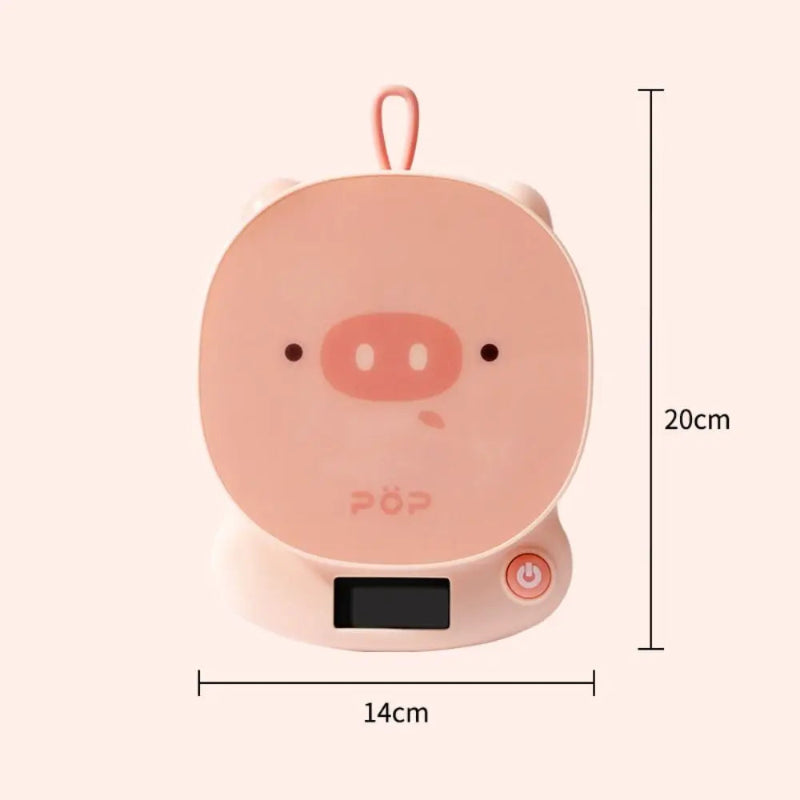 Pink pig-shaped scale with dimensions on a white background