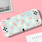Gaming console with bunny and flower pattern on a pink background