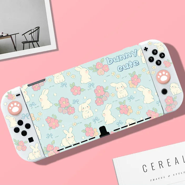 Gaming console with bunny and flower pattern on a pink background