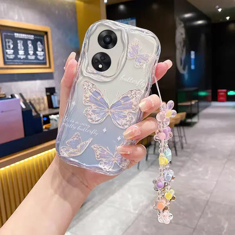 Phone case with butterfly design held by a hand in an indoor setting, this design has butterfly outlined by golden glitter.