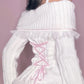 Rear view of a Kawaii Coquette Off Shoulder Ribbon Sweater modeled by a woman in white