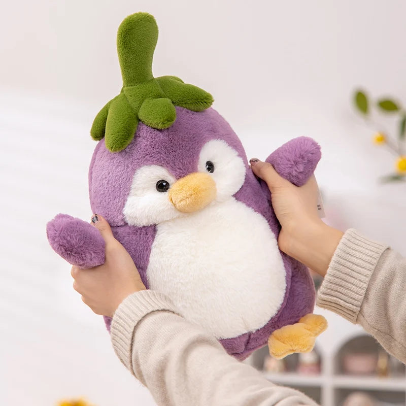 Front view of Kawaii Cute Penguin Eggplant Plushie held by a woman