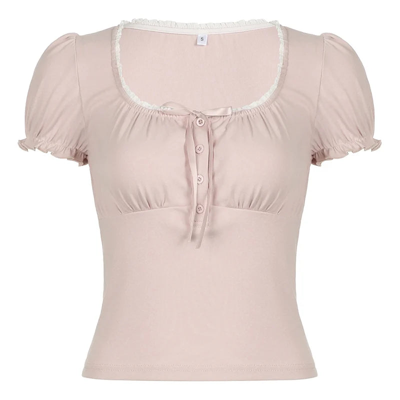 Pink blouse with lace trim on a white background