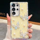 Phone case with butterfly and pearl designs held by a hand, case is pastel yellow