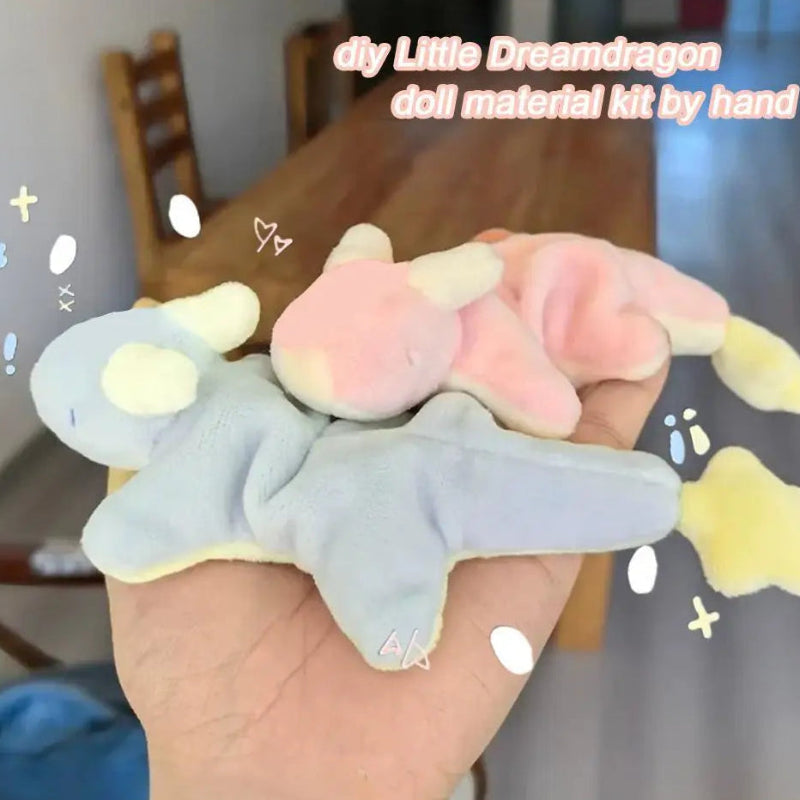 Kawaii Star Dragon Plushie Craft Kit  in blue and pink colors being held by a woman in her hand