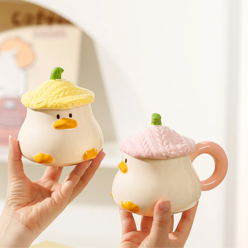 Hand holding Kawaii Duck Mug with Lid 