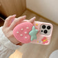 Rear view of Kawaii Sweet Strawberry Butterfly iPhone Case held by a woman