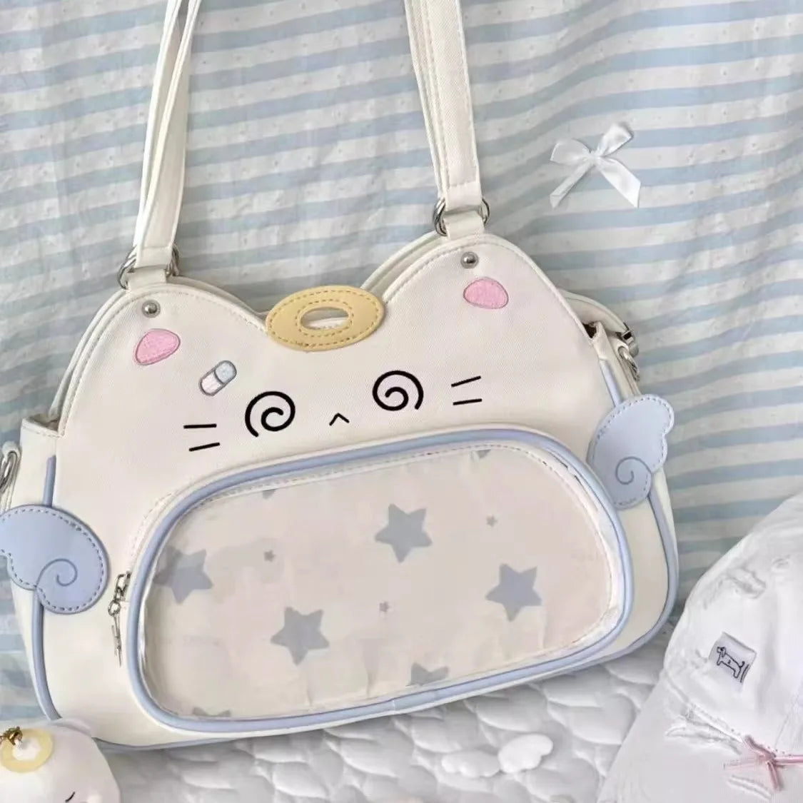 Cute cat-shaped handbag on a striped background