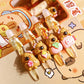 Set of cute capybara pens inside of a notebook on a cartoon-themed background