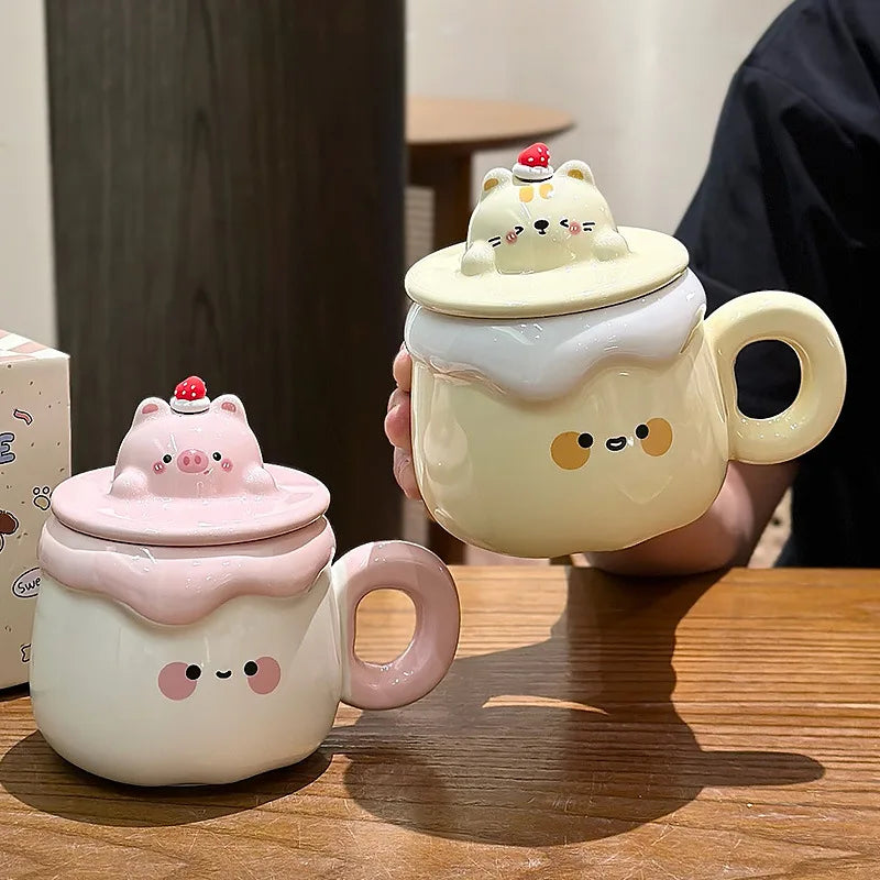 Kawaii Animal Pudding Ceramic Mug  being held by a person in a black t-shirt
