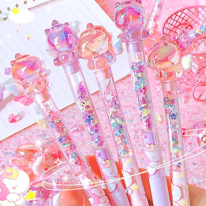 Set of decorative pens with cartoon character tops on a pink background, featuring the brand 'Dreamlike'.