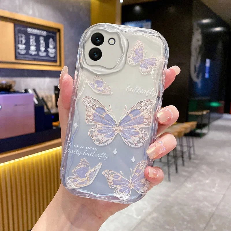Phone case with butterfly design held by a hand in a casual setting, this is the design which displays the outlines of a butterfly with glittery gold and no lanyard.