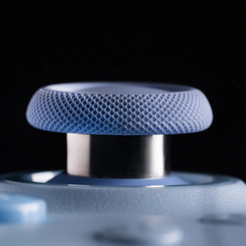Close-up of a blue textured object with a metallic center on a black background