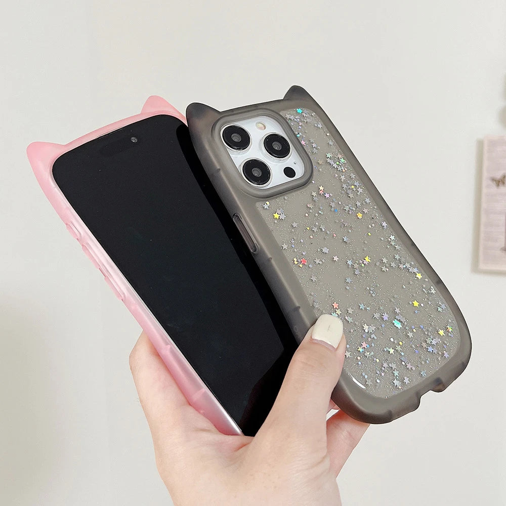 Phone case with cat ears held by a hand against a light background