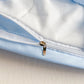 White duvet cover with bows and ribbons , close up of material and zip