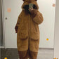 Person wearing a brown capybara onesie taking a mirror selfie.