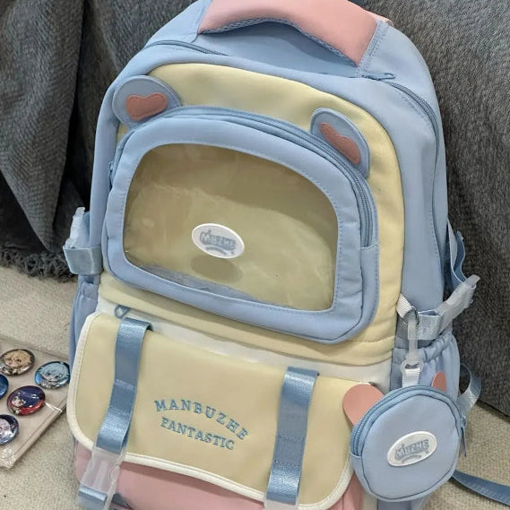 beary cute backpack with bear ears and a visible brand logo on a textured surface, blue version