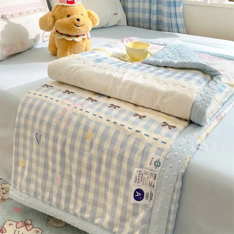 Kawaii Spring Quilts, the set being shown is the Cute Bow Design with Blue, displayed on a bed half open.