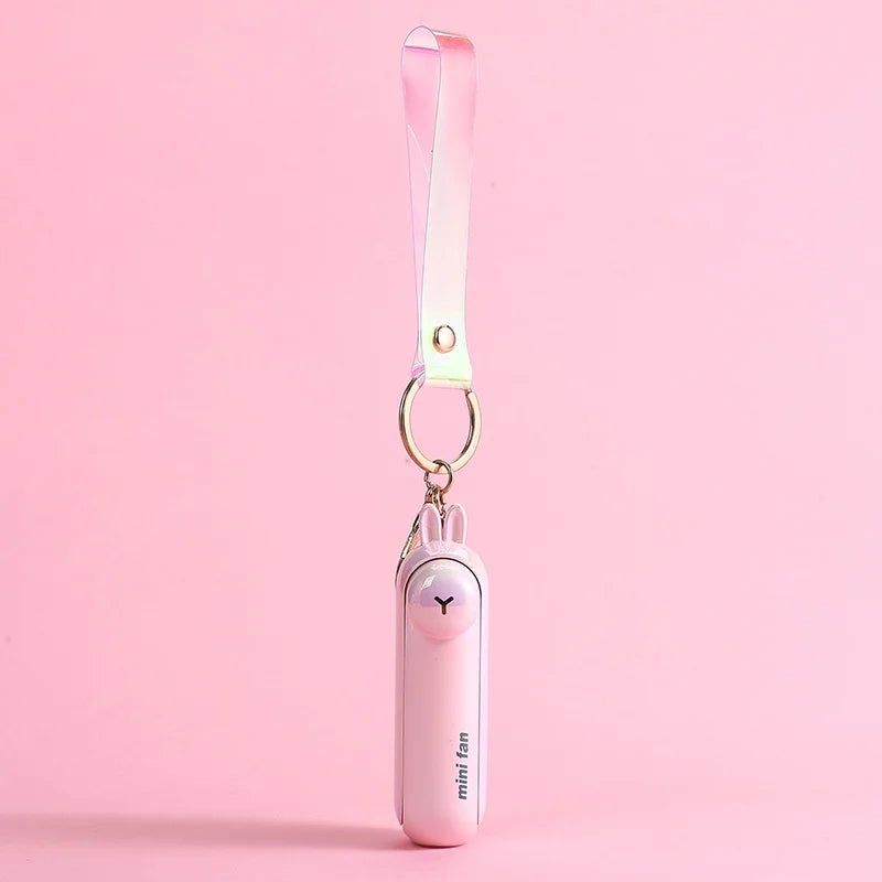 Pink mini fan with rabbit design on a pink background