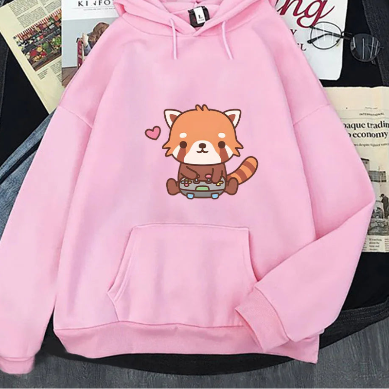 Pink hoodie with a red panda design on a surface with newspapers underneath