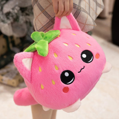 Front view of Kawaii Strawberry Cat Plushie held by a woman