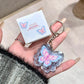 women holding kawaii blue butterfly lip gloss keychain with case