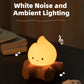 Cute campfire shaped night light with a dark background and text about white noise and ambient lighting.