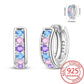 Silver hoop earrings with colorful gemstones and 'STERLING 925' stamp on a white background.