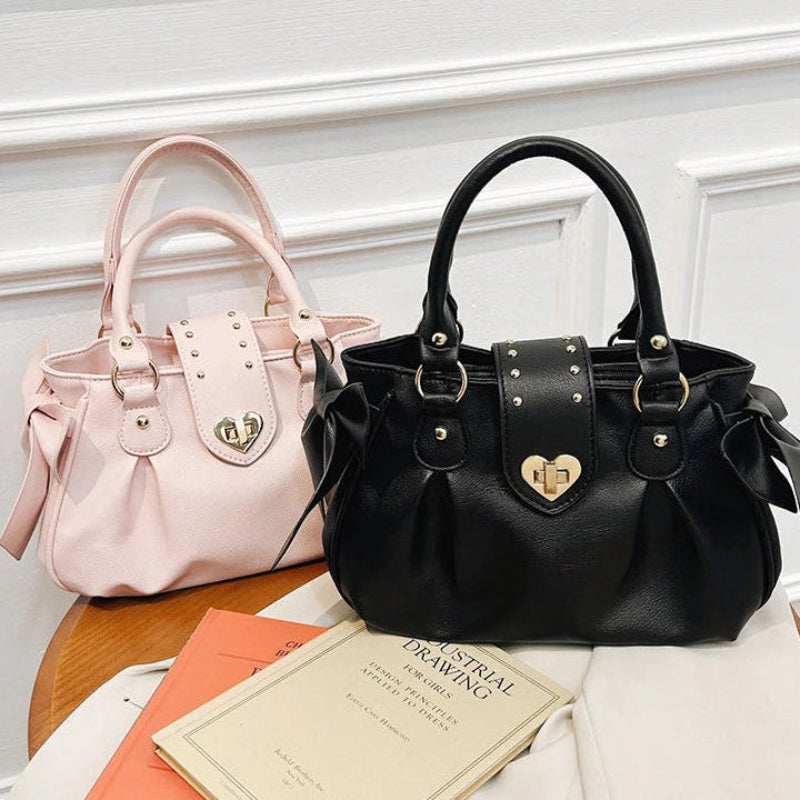 Kawaii Sweet Heart Lock Bags in Pink and Black on a table 