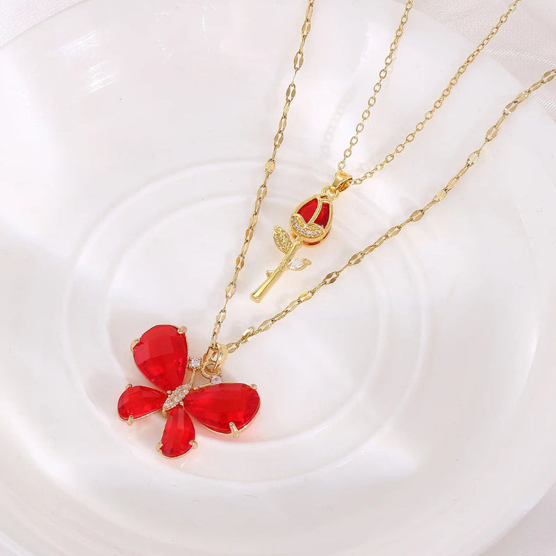 Kawaii Enchanting Butterfly Rose Necklace in red color on a plate 