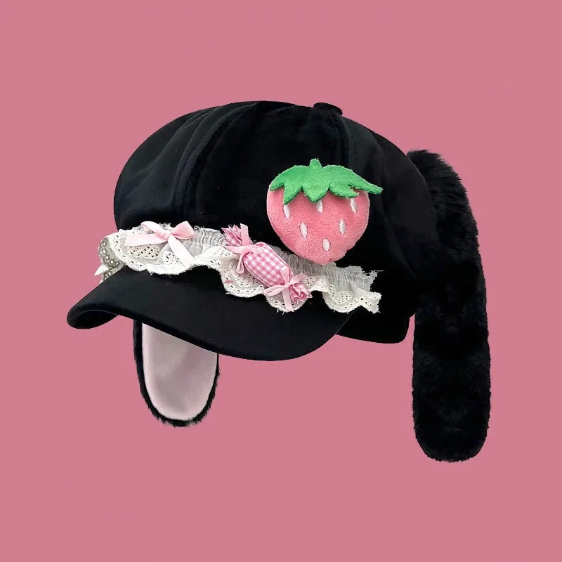 Black kawaii bunny hat with strawberry decoration on a pink background
