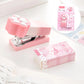 Kawaii Pastel Cat Paw Stapler, this image is showing the pink stapler next to the box it comes in.