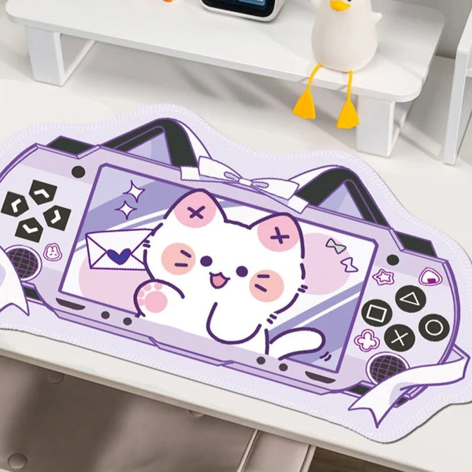 Mouse pad with a kawaii design of a cat  on a desk.