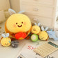 four kawaii bee plushies sitting on a white desk.