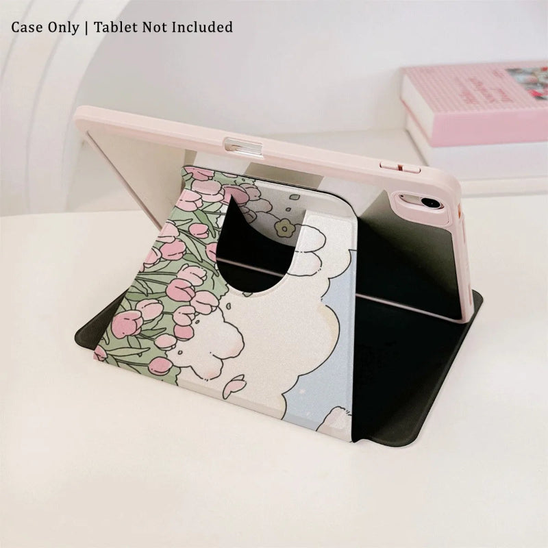 the Kawaii Tulips & Bunnies iPad Case being displayed on an ipad, bunnies in a tulip meadow with fluffy white clouds and blue sky is on the case itself. the ipad is on its side and is being propped up by the case.