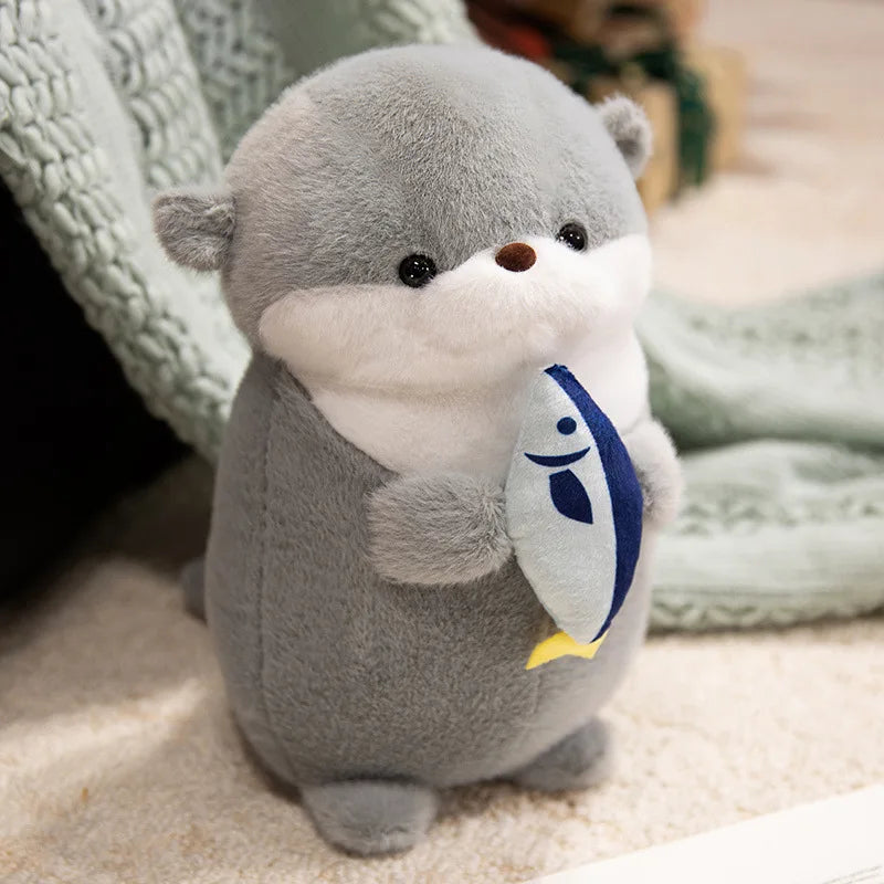 Adorable Kawaii Grey Otter Plushie holding fish 