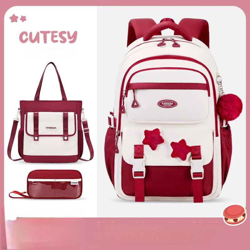 Red and white backpack with matching handbag and pouch on a pink background, featuring the brand 'CUTESY'.