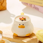 Kawaii Duck Mug with Lid on cutting board