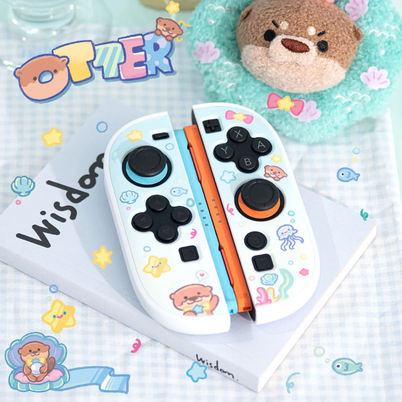 Pair of white gaming controllers with cartoon designs on a light blue checkered background with 'Otter' 