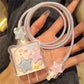 iPhone charger cover with star design held by a hand