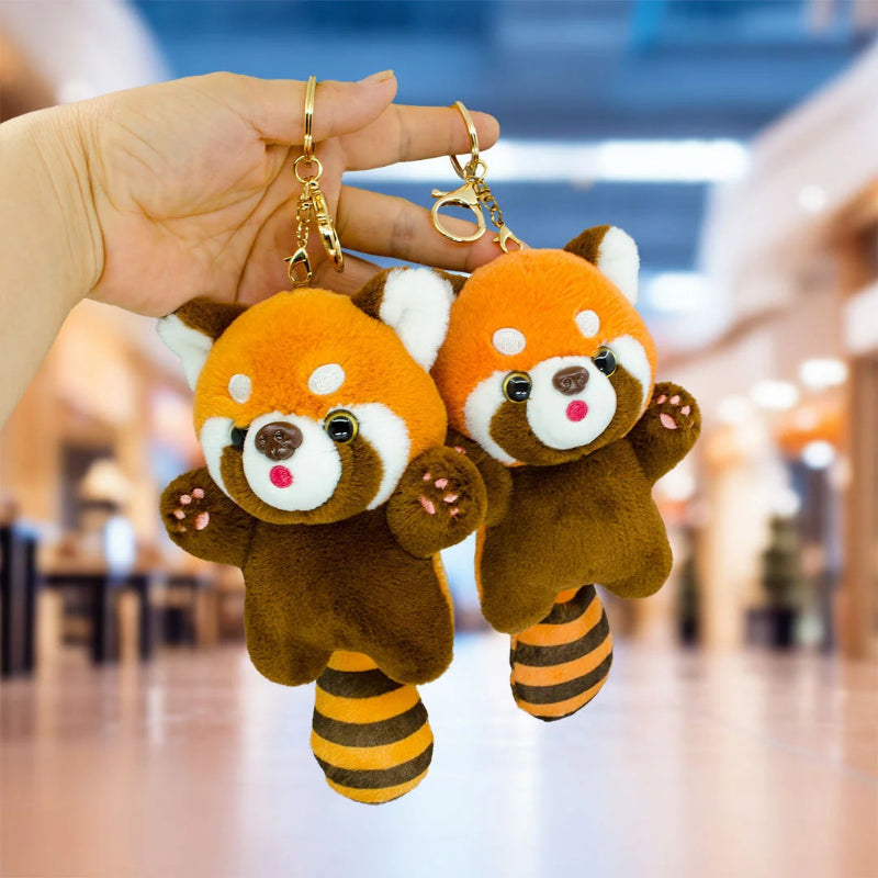 Woman holding Kawaii Red Panda Plushie Pendant Keychains with a blurred town background