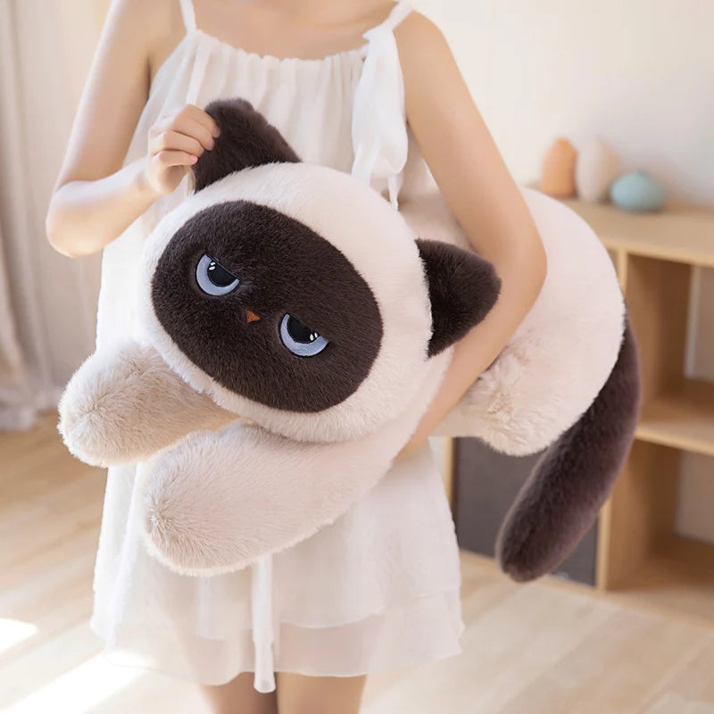 Woman holding a beige Kawaii sleepy cat body pillow plushie 