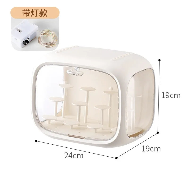 A small white and beige LED light figurine case with dimension markings showing 24cm length, 19cm width, and 19cm height, plus an inset showing the included white power adapter and warm white LED lights.