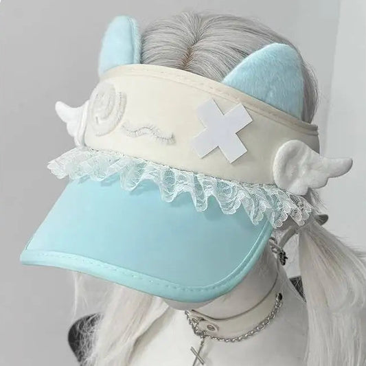 Light blue visor with decorative elements on a mannequin head against a gray background