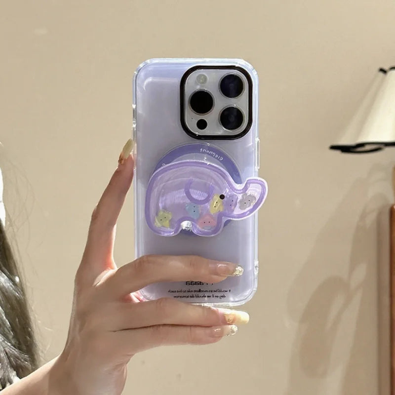 a woman holding a  phone with kawaii cute elephant quicksand phone grip , this is in the color purple with colorful elephant faces inside on a white background
